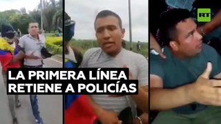 Manifestantes retienen a policas 'infiltrados' en Colombia y los entregan ilesos